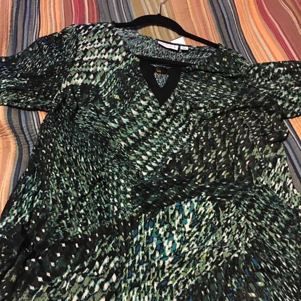 Susan Grover long sleeve, jewel at the neckline.